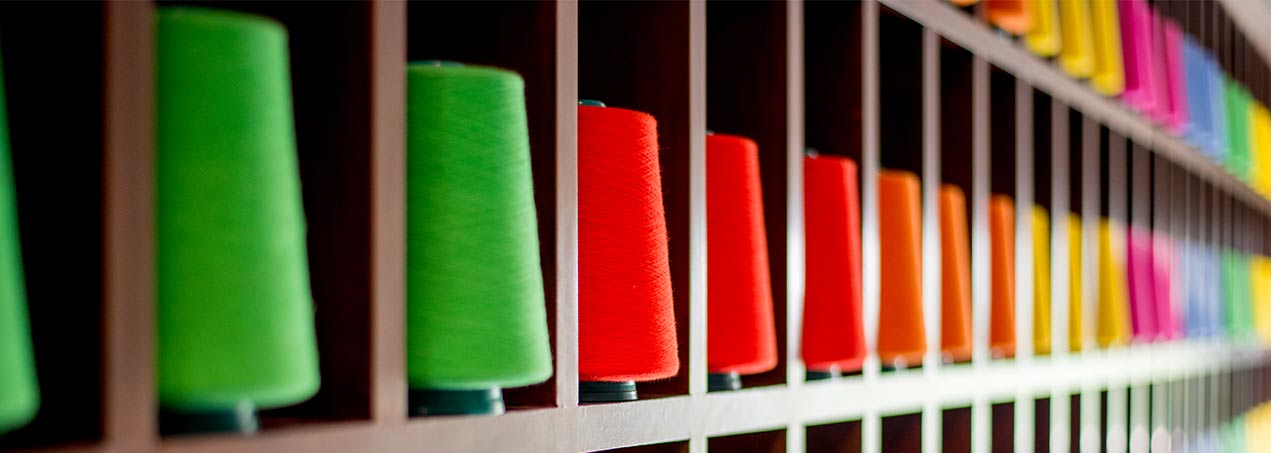 Dyed yarn cones on racks